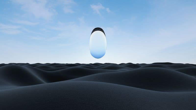 Surreal glass floating over desert Wallpaper
