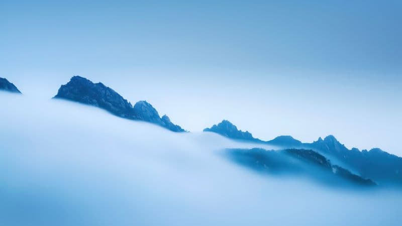 Above clouds Mountains Wallpaper