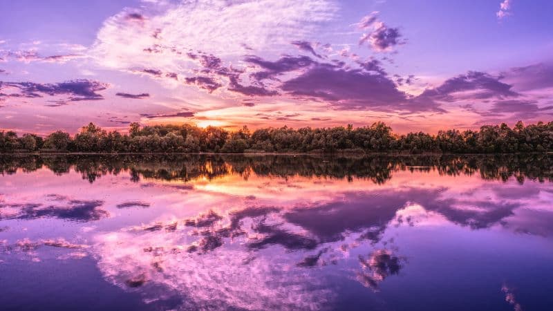 Purple sunset over lakes aesthetic Wallpaper