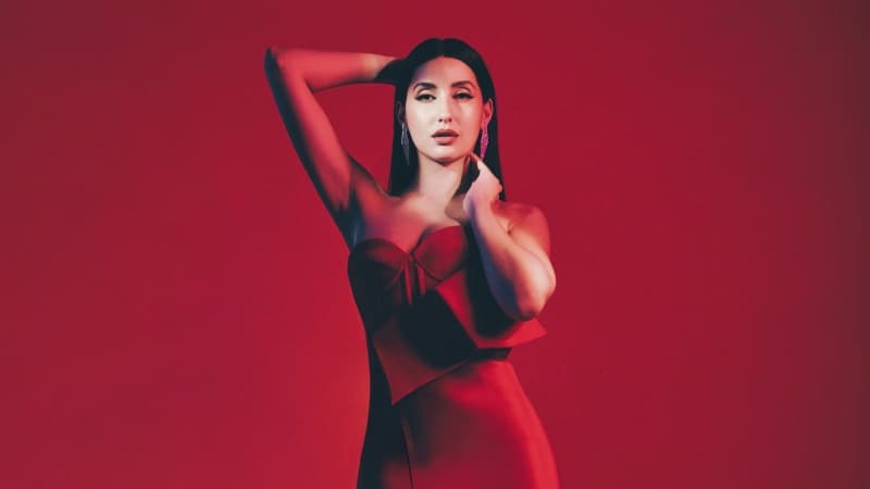 Nora Fatehi Red background Wallpaper
