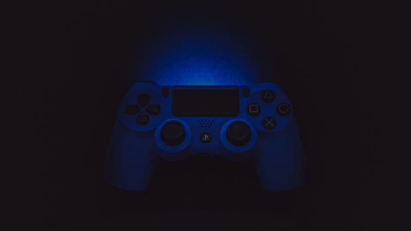 Sony DualShock 4 Black background Wallpaper