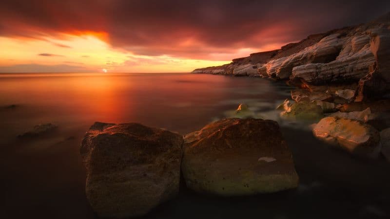 Rocky shoreline Sunset Wallpaper