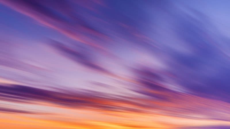 Sunset sky with purple and orange clouds wallpaper