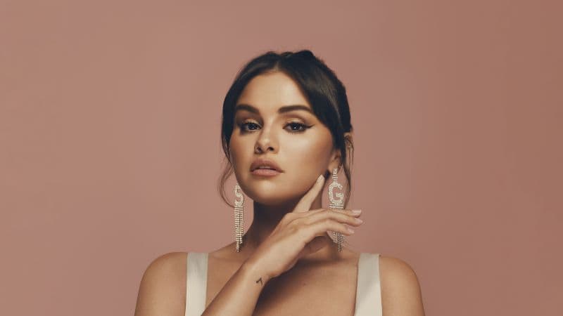Selena Gomez Peach background Wallpaper
